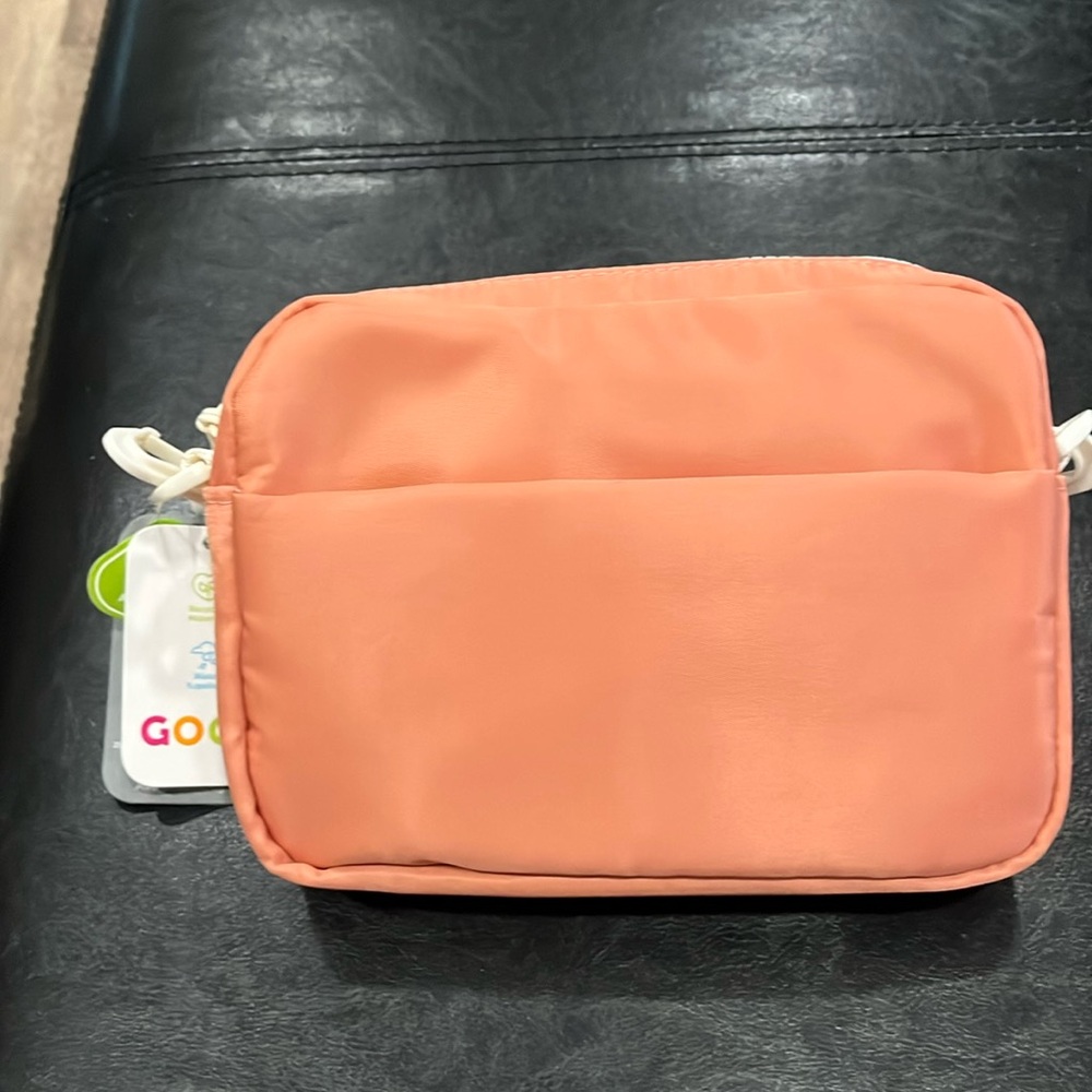 Ava crossbody nylon bag. Light orange with off white zipper and strap